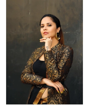 Anchor Anusuya In Black Saree Stills